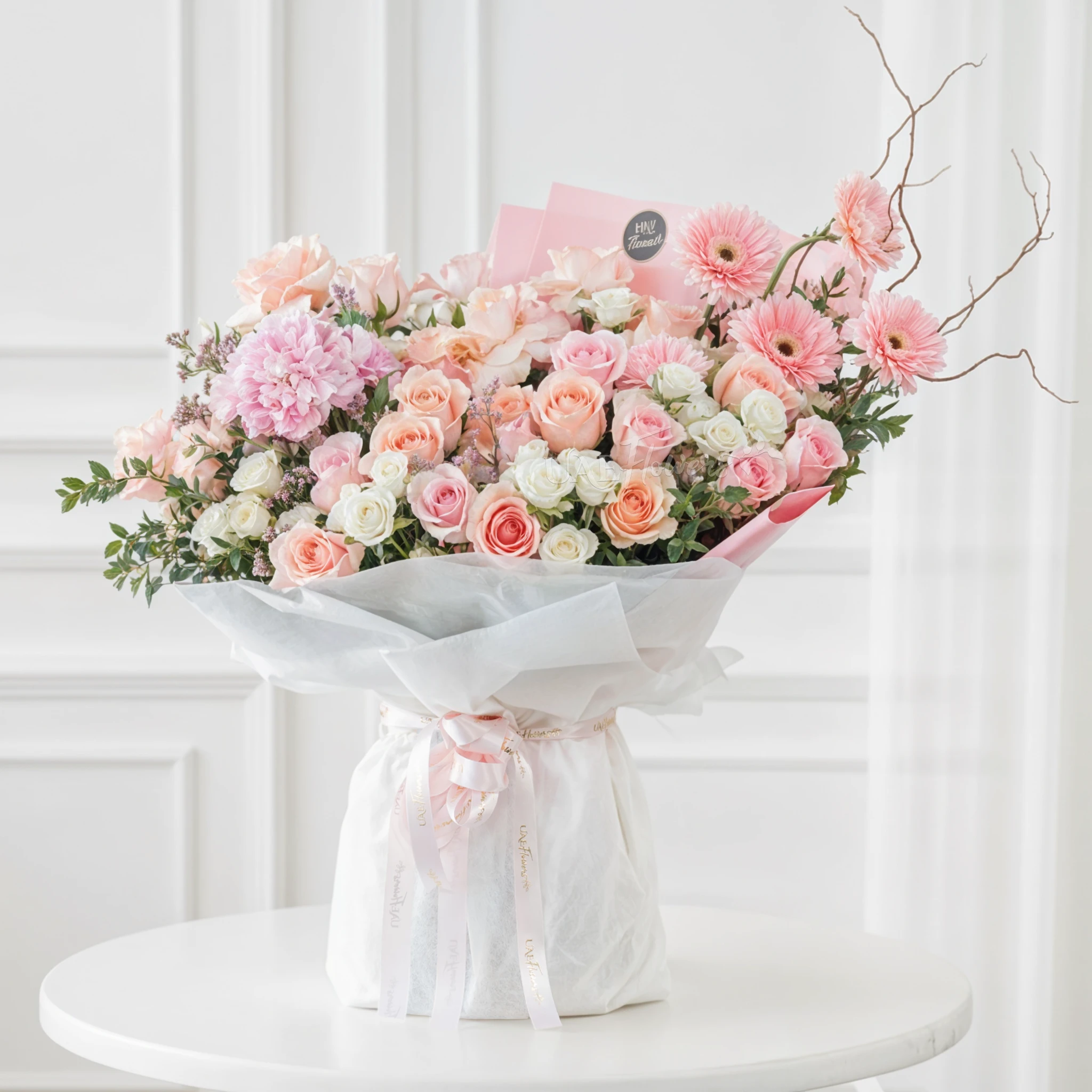 bouquet of pink roses, gerberas,  white spray roses, and hydrangea