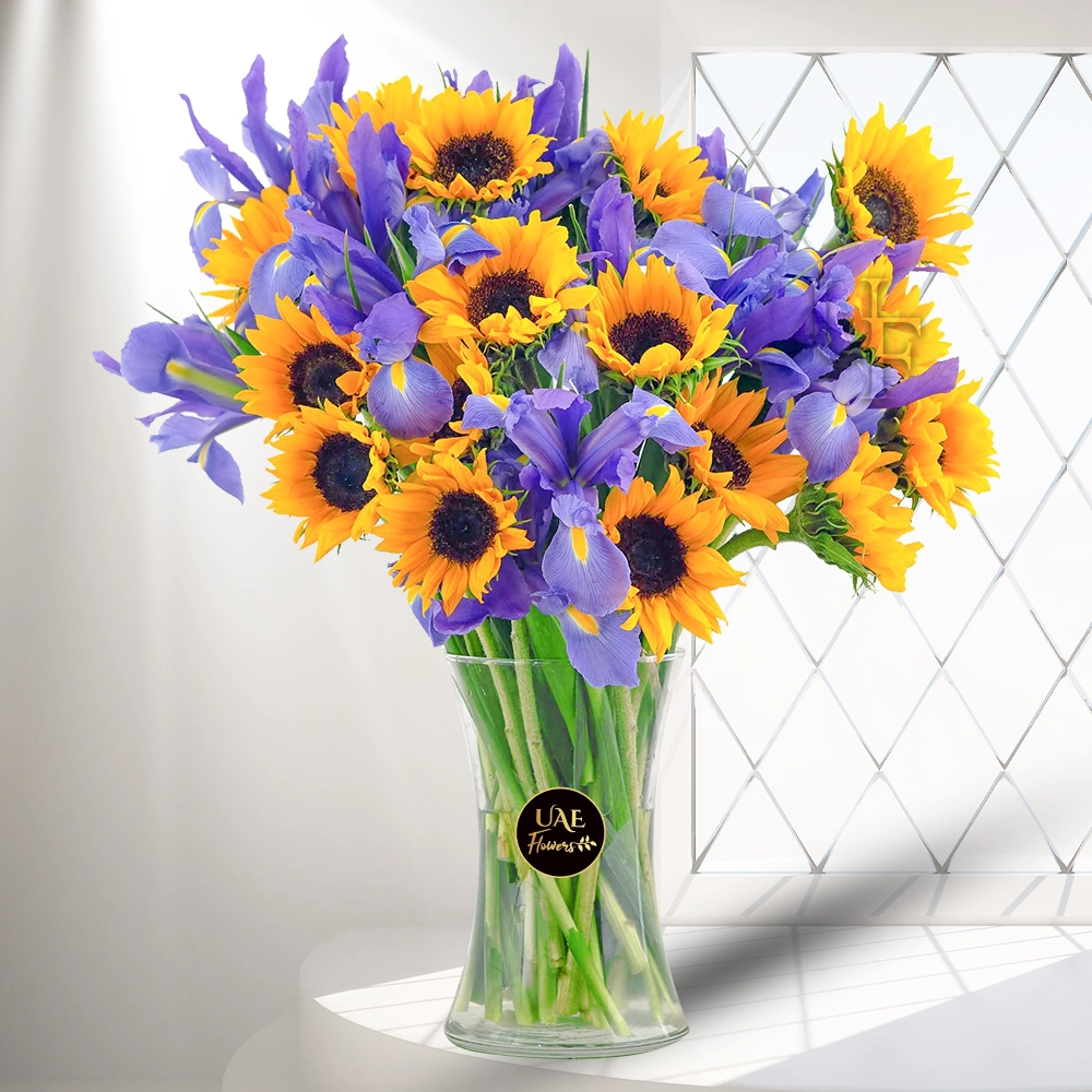 15 sunflowers, 15 iris flowers, & fillers in a glass vase