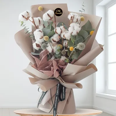 Rustic bouquet of Gossypium cotton flowers with pompoms and eucalyptus fillers, perfect for natural home décor or gifting