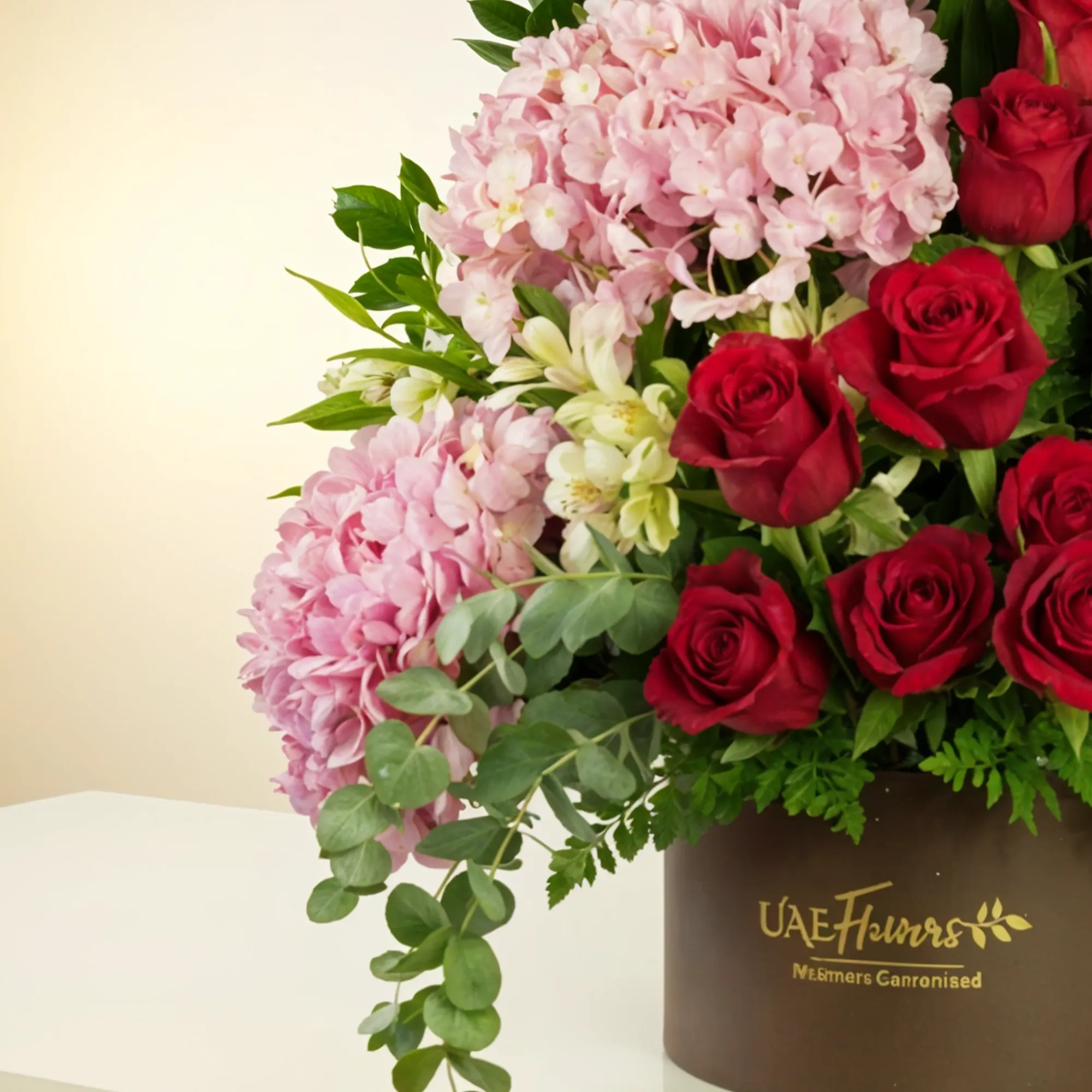 2 pink hydrangeas, 2 pink lilies, 2 white alstroemerias, 15 red roses