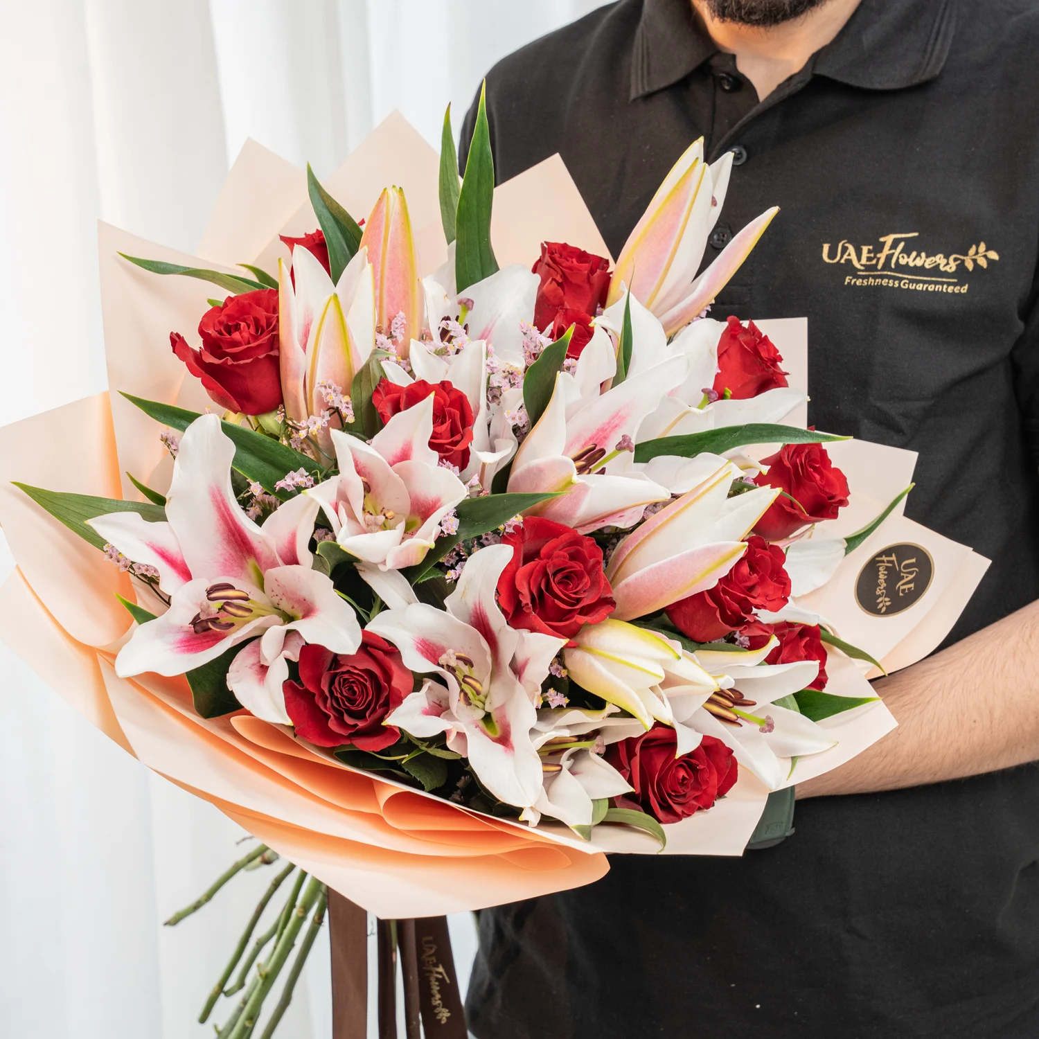 red roses, pink stargazer lilies