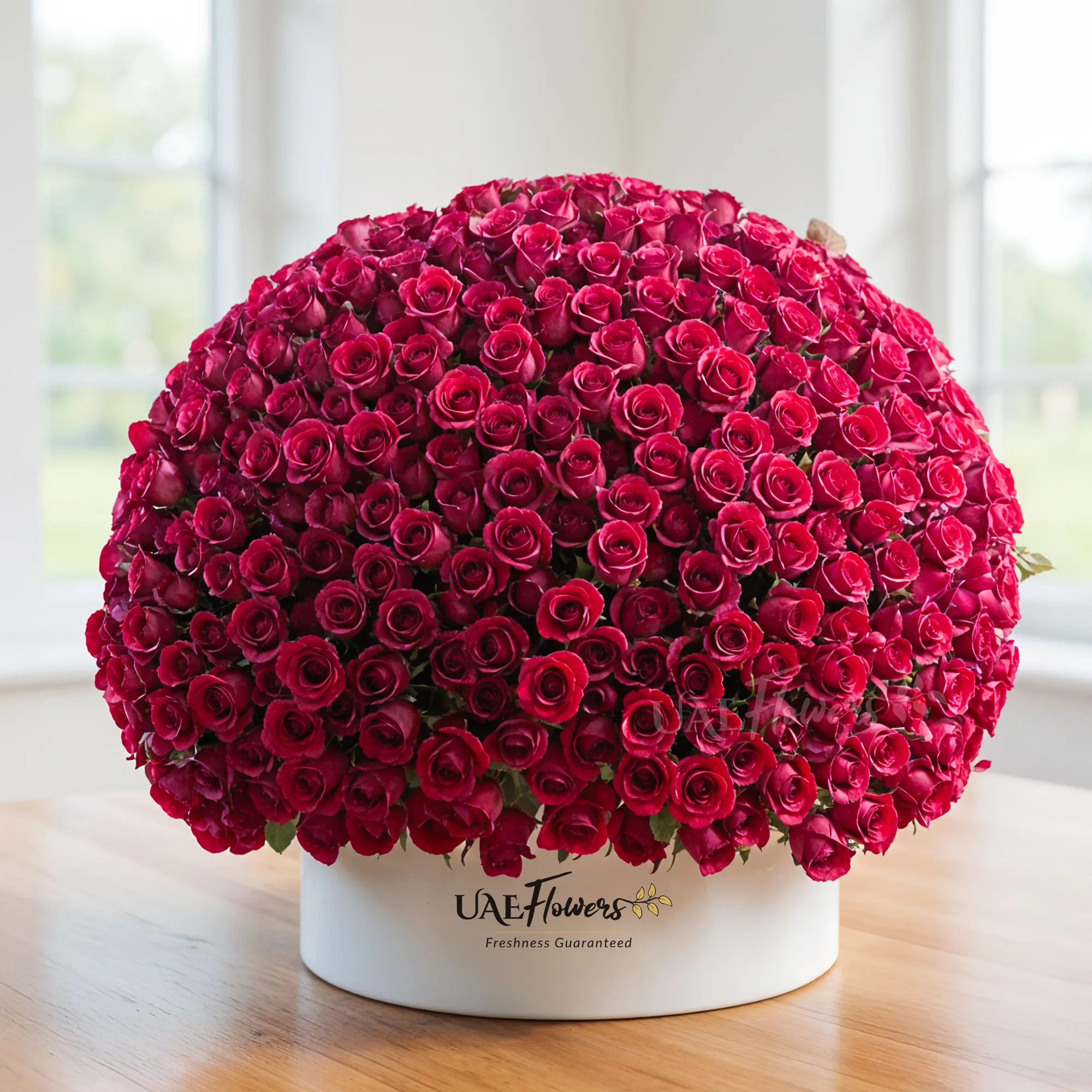 round box arrangement of 1000 red roses