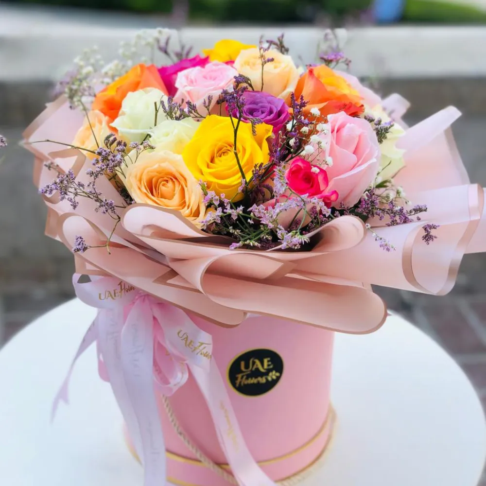 20 mix color roses with fillers in a round box