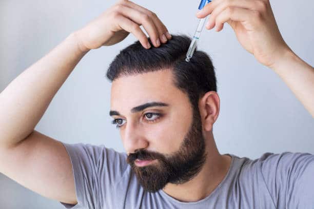 A Man Applying Lavender Oil